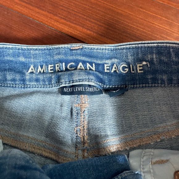American Eagle High Rise Crossover Waist Ripped Flare Jean - Picture 3 of 5